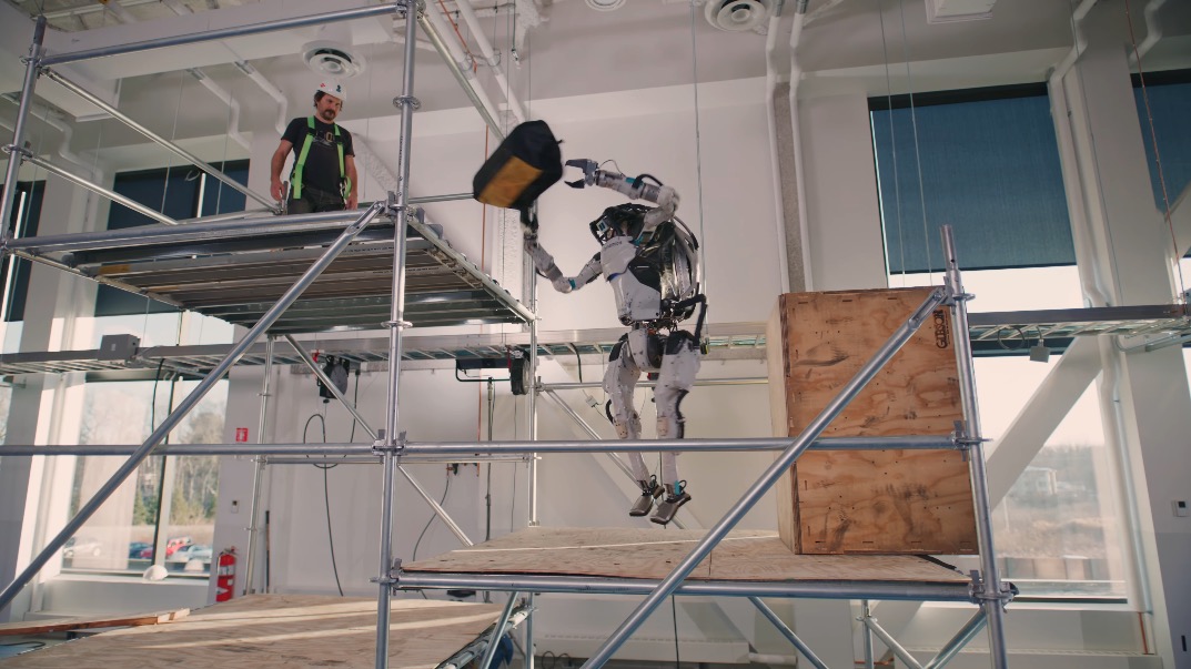 Boston Dynamics’ latest Atlas video demos a robot that can run, jump and now grab and throw